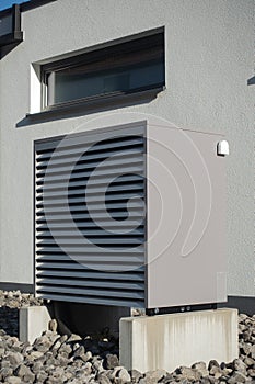 heat pump in a new building area with modern house facades