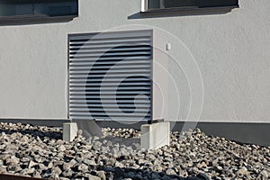 heat pump in a new building area with modern house facades