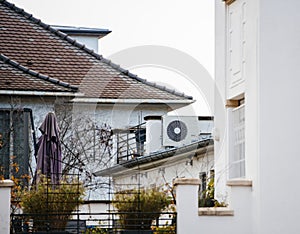 Heat pump on the rooftop of a house building - environmentally friendly solution