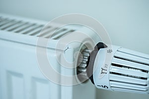 Heat regulator on a heater, close up picture. Heating Costs