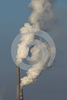 Heat station smoke stack against blue sky