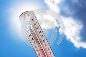 Heat, thermometer shows the temperature is hot in the sky, Summer