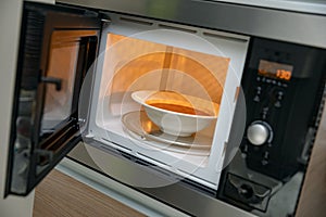 Heat up food in microwave oven