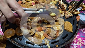 Heat various pieces of processed meat in a grill pan