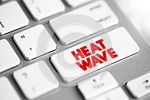 Heat Wave is a period of excessively hot weather, text concept button on keyboard