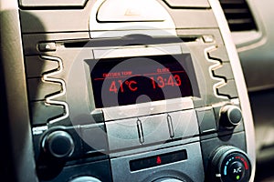 Heat waves in summer. High temperature on car dashboard display. Hot day