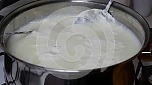 Heated milk coagulates and light green liquid occurs over the milk