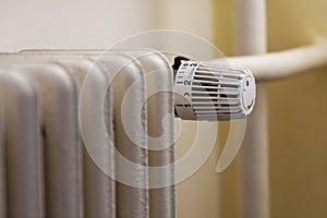 A heater with a thermostatic regulation valve. photo