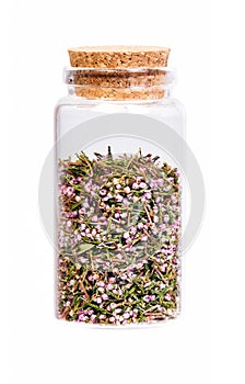 Heather blossom tea in a bottle with cork stopper.