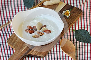 Heathy Meal Plain Yogurt with Nuts in White Bowl