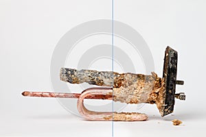 Heating element for heating water in domestic water heaters and boilers on white background. Copy space. Before and after