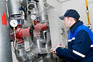 Heating engineer in boiler room