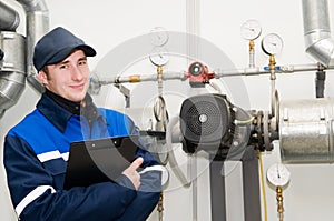 Heating engineer in boiler room