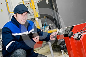 Heating engineer in boiler room