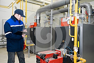 Heating engineer in boiler room