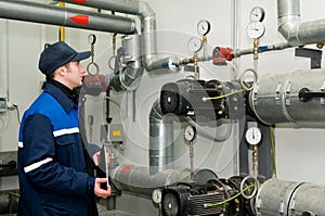 Heating engineer in boiler room