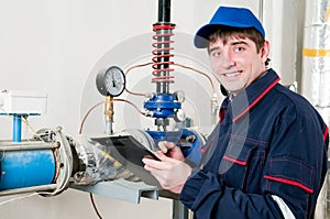 Heating engineer in boiler room