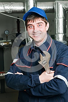 Heating engineer in boiler room