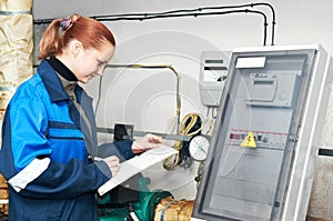 Heating engineer in boiler room