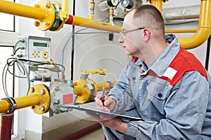 Heating engineer in boiler room