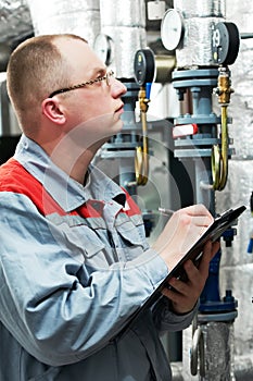 Heating engineer in boiler room