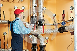 Heating engineer repairman in boiler room