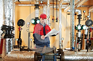 Heating engineer repairman in boiler room