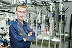 Heating engineer repairman in boiler room