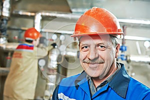 Heating engineer repairman in boiler room