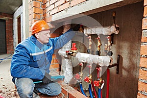 Heating engineer repairman in boiler room