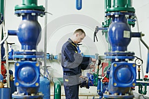 Heating engineer repairman in boiler room