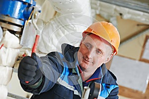 Heating engineer repairman in boiler room