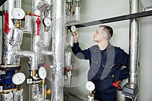 Heating engineer repairman in boiler room
