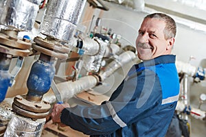 Heating engineer repairman in boiler room