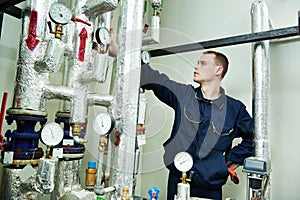 Heating engineer repairman in boiler room