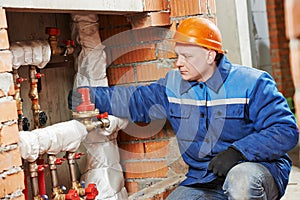 Heating engineer repairman in boiler room