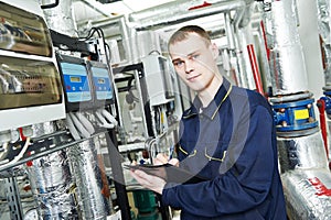 Heating engineer repairman in boiler room