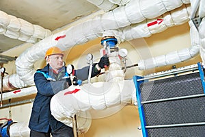 Heating engineer repairman in boiler room