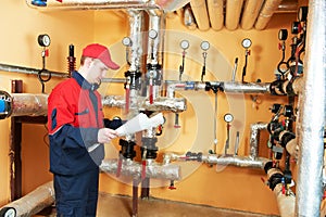 Heating engineer repairman in boiler room