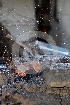 Heating the fire from an old style blacksmith