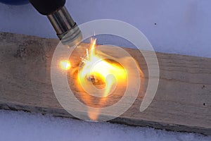 Heating the gas torch pieces of metal