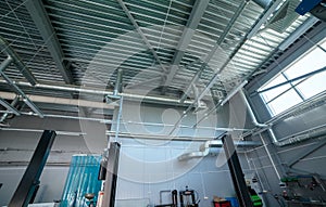 Heating pipe system in the warehouse of the enterprise. general plan with hoods on the ceiling