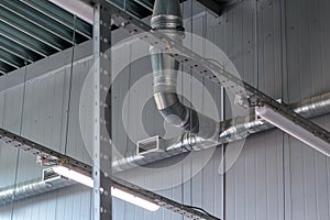 Heating pipe system in the warehouse of the enterprise.Technological pipes with holes
