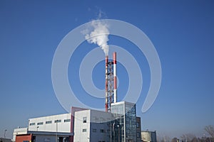 Heating plant - powerhouse and chimey with smoke