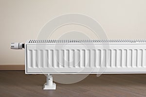 Heating radiator with thermostatic knob in the living room