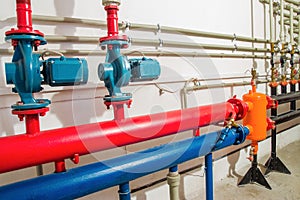 Heating system in a boiler room. powerful pumps red and blue tubes pipe