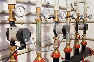 Heating system in a boiler room. powerful pumps red and blue tubes pipe