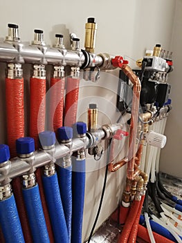 Heating system with copper pipes, valves and other equipment in a boiler room