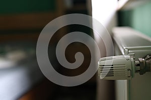 Regulator of heating system radiator in the bedroom