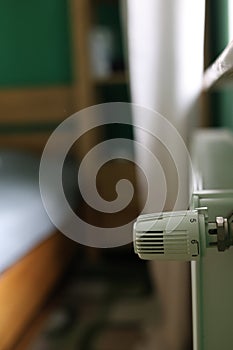 Regulator of heating system radiator in the bedroom